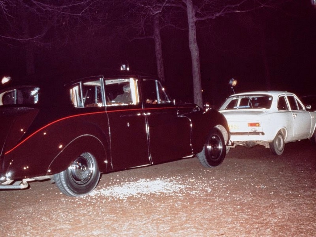 1974_the_aftermath_of_ian_ball_s_attempt_to_kidnap_princess_anne_ball_s_white_ford_escort_is_parked_blocking_the_path_of_the_princess_s_rolls_royce_limousine.jpg