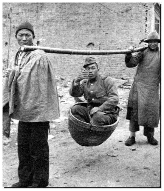 1938_japanese_army_officer_makes_two_chinese_men_carry_him.jpg