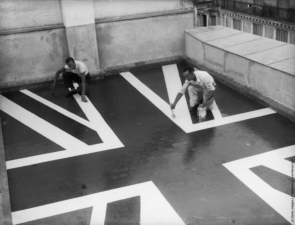 1936_workmen_paint_a_union_jack_flag_on_the_roof_of_the_british_embassy_in_madrid_during_the_height_of_the_siege_by_rebel_troops.jpeg