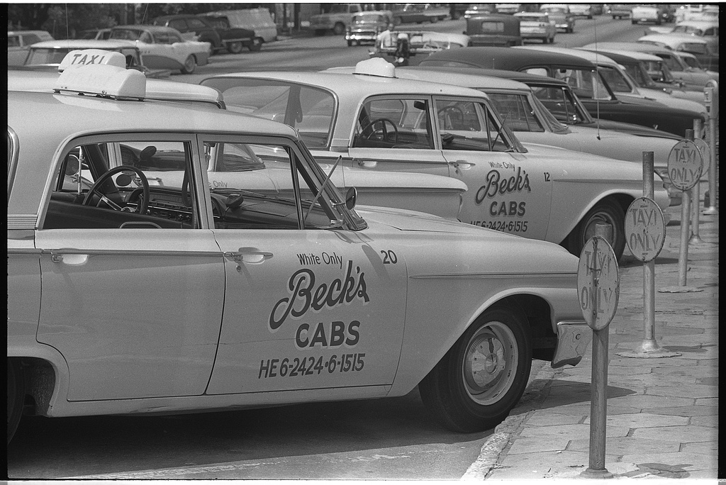1962_taxi_cabs_with_sign_white_only_on_side_albany_georgia.jpg