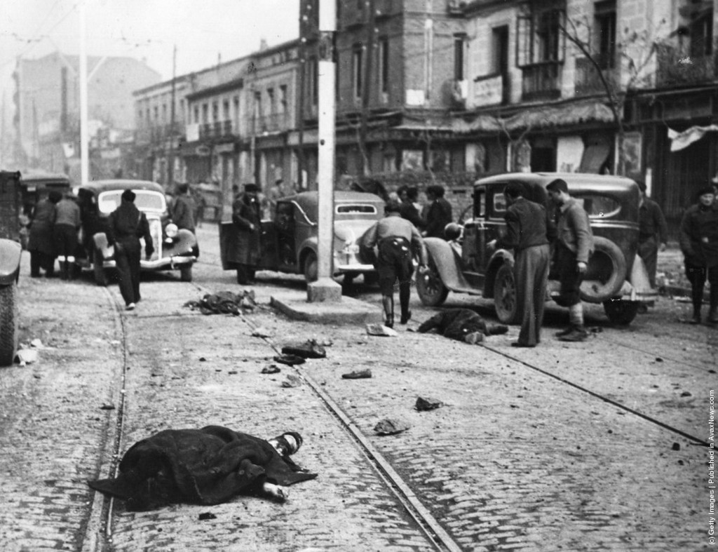 1937_victims_of_a_sudden_air_raid_lie_in_a_street_during_the_spanish_civil_war.jpeg