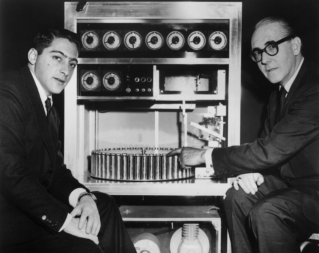 1960_film_producer_mike_todd_jr_with_hans_laube_the_inventor_of_smell-o-vision_the_device_injected_at_least_30_odors_into_a_movie_theater_triggered_by_the_film_s_soundtrack.jpg