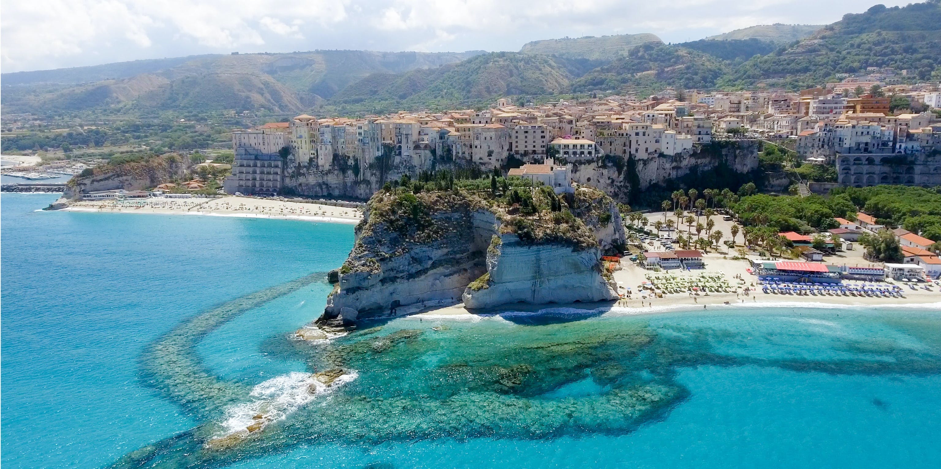 italy-calabria-tropea-houses-and-beach-view-from-the-sea-fotolia-2-jpg_header-245531.jpeg