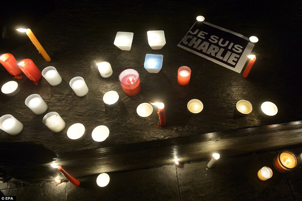 247c7dac00000578-2900835-geneva_candles_and_a_je_suis_charlie_mark_another_peaceful_prote-a-12_1420669628125.jpg