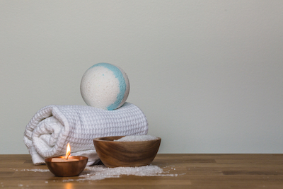 canva_photo_of_towel_and_bath_bomb_near_candle.jpg