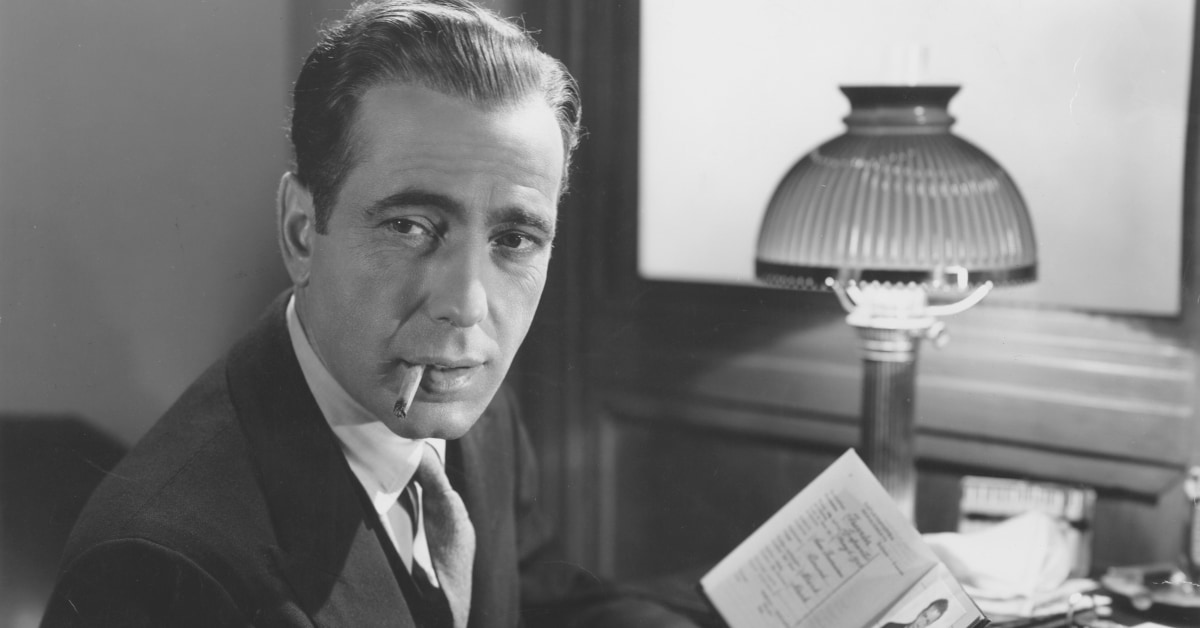 maltese-falcon-1941-001-humphrey-bogart-smoking-holding-passport-00n-0g3_1200x628.jpg