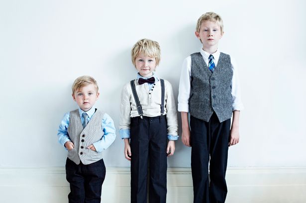 prod-brothers-wearing-suits-indoors.jpg