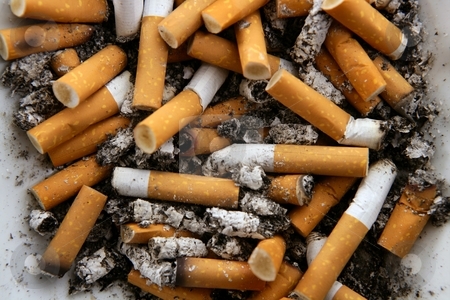 cutcaster-photo-100330054-Ashtray-full-of-cigarettes-Dirty-tobacco-texture.jpg