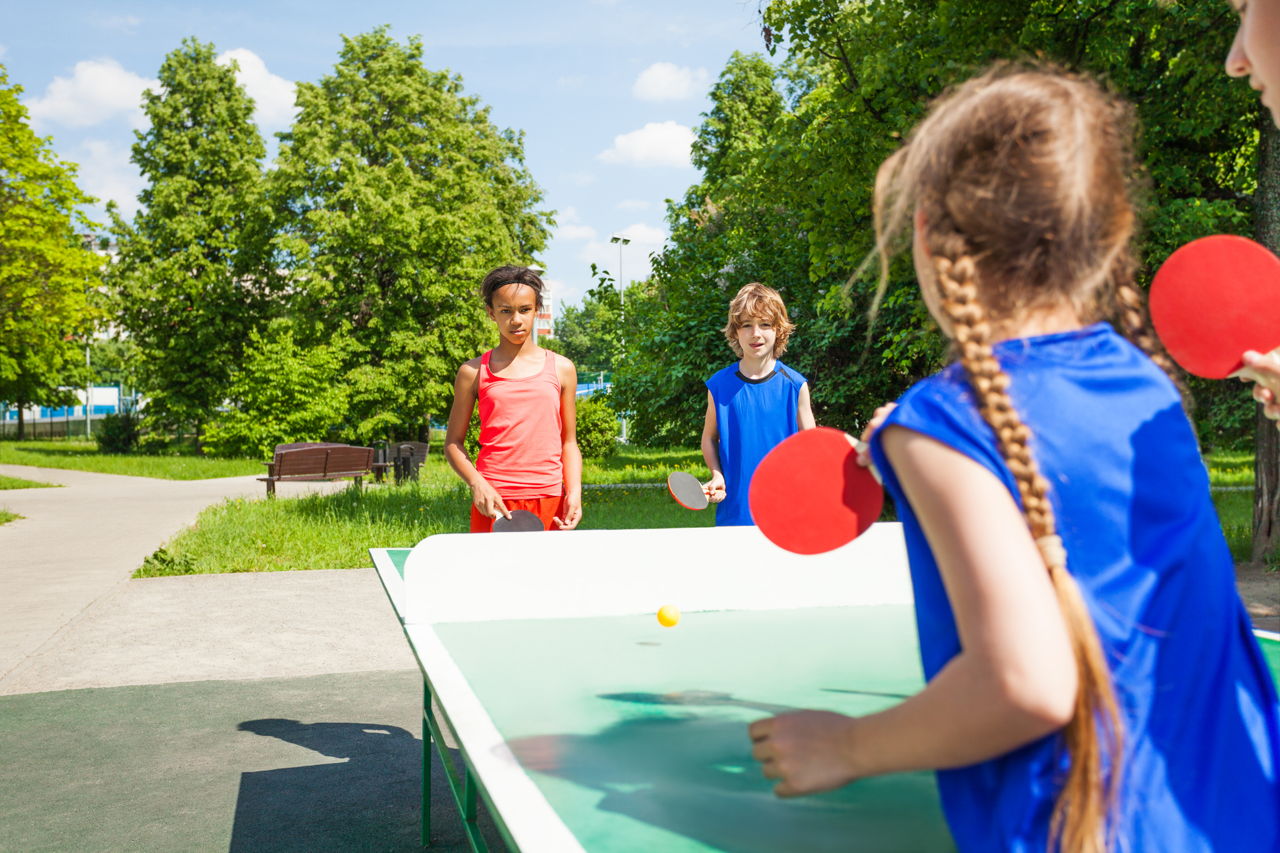 1280-484676590-four-international-friends-play-table-tennis.jpg