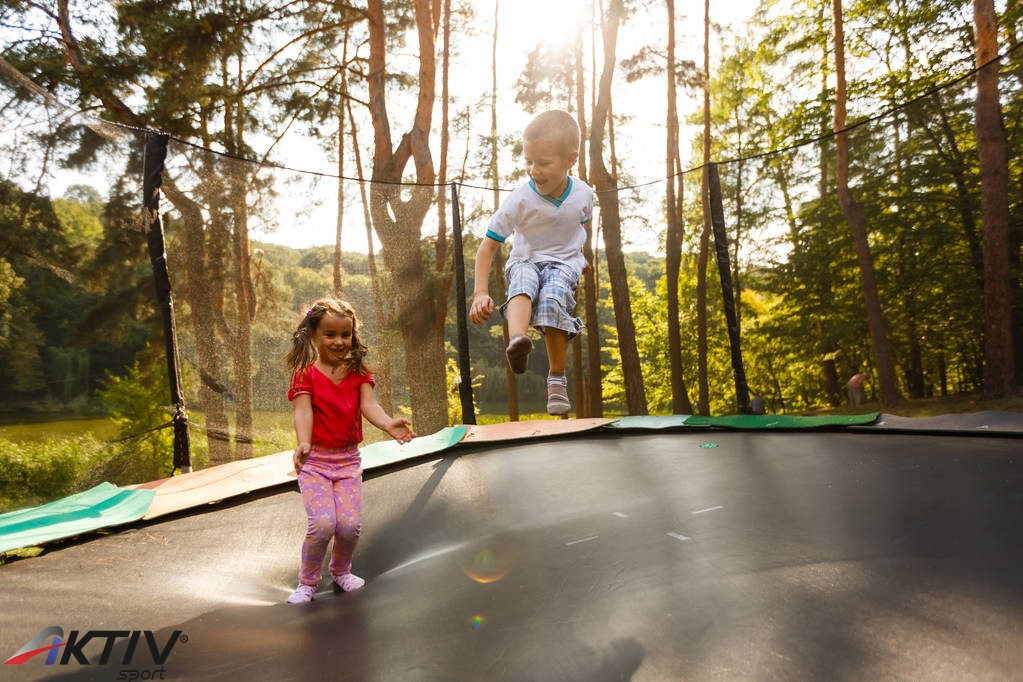 stock-photo-little-children-trampoline-garden.jpg