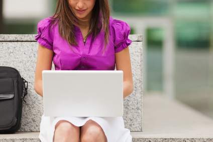 stockfresh_433921_businesswoman-using-laptop-outdoors_sizexs.jpg