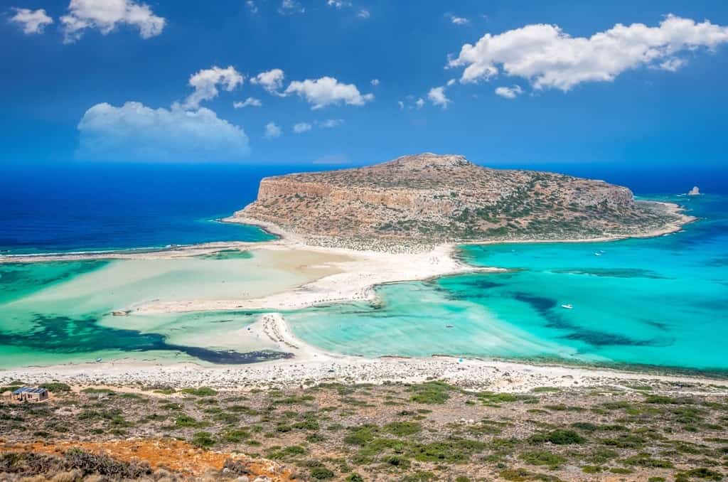 balos-lagoon-on-crete-island-greece_-tourists-relax-and-bath-in-crystal-clear-water-of-balos-beach_-min.jpg