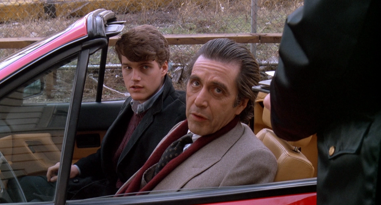 scent-of-a-woman-1992-al-pacino-with-chris-o-donnell-in-a-car-stopped-by-police-movie-still.png