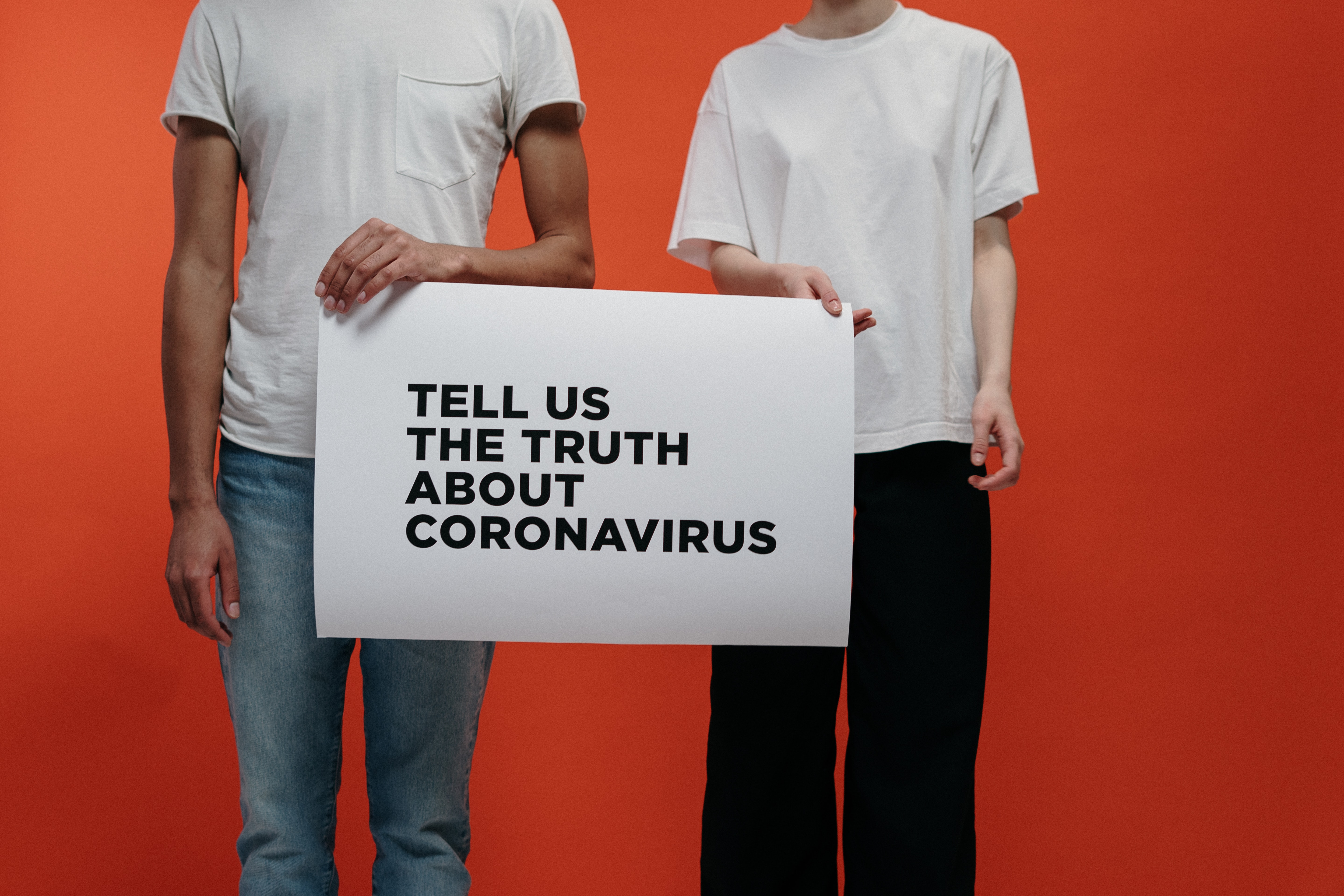 people-holding-a-poster-asking-about-facts-on-coronavirus-3952215.jpg