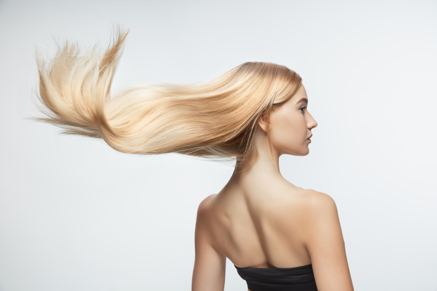 beautiful-model-with-long-smooth-flying-blonde-hair-isolated-white-studio-background-young-caucasian-model-with-well-kept-skin-hair-blowing-air_1.jpg