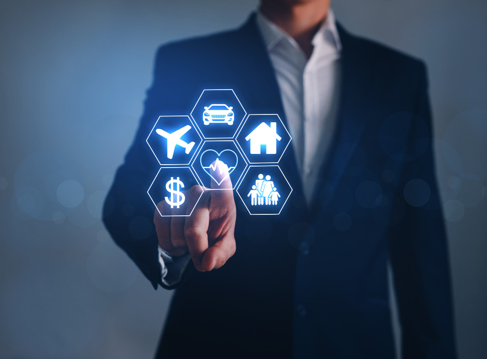 businessman-pointing-digital-icons-car-travel-family-life-house-finance.jpg