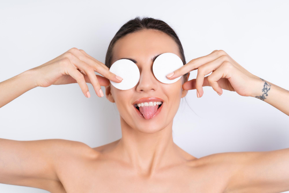 close-beauty-portrait-topless-woman-with-perfect-skin-natural-makeup-removing-cotton-pads-white-backgroundx9.jpg