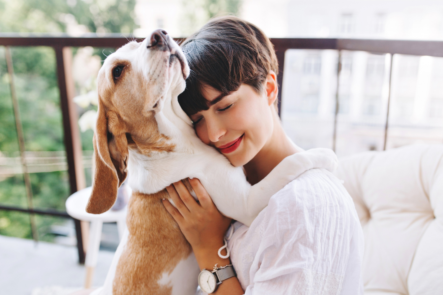 close-up-portrait-pleased-girl-with-short-brown-hair-embracing-funny-beagle-dog-with-eyes-closed.jpg