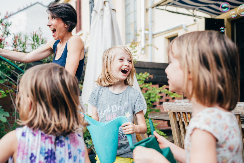 mother-gardening-home-with-three-daughter.jpg