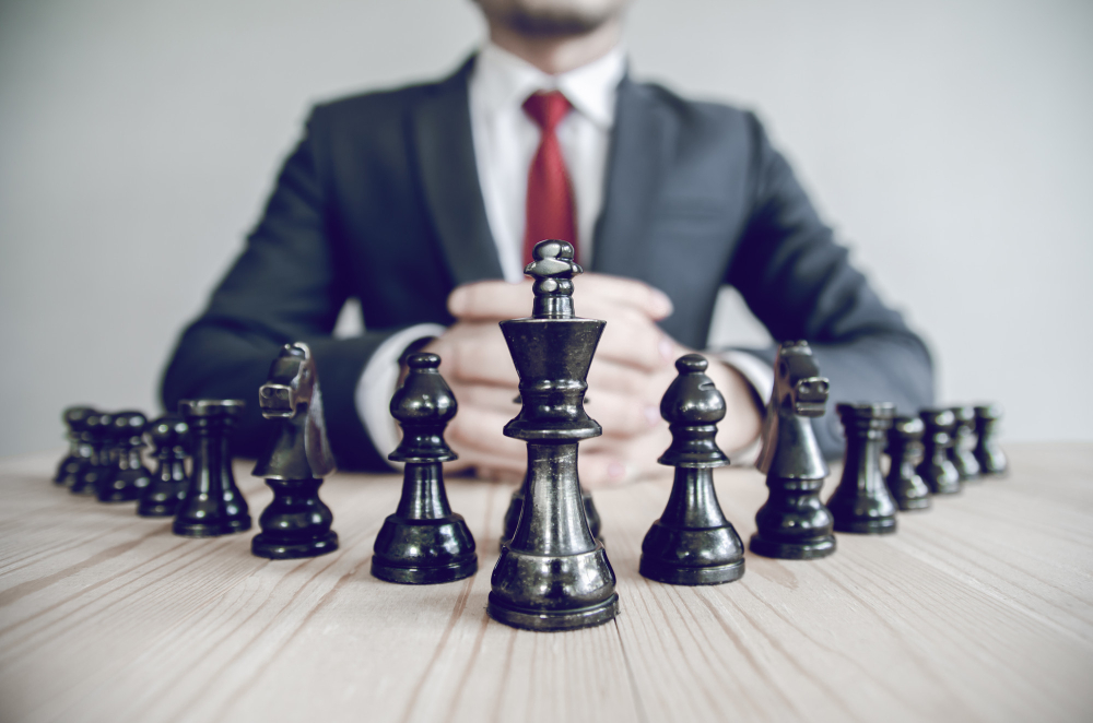 retro-style-image-businessman-with-clasped-hands-planning-strategy.jpg