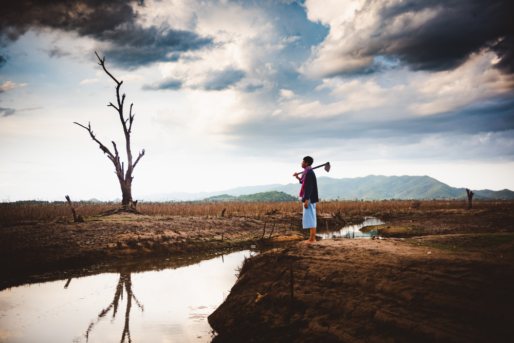water-crisis-concept-hopeless-lonely-farmer-sit-cracked-earth-near-drying-water.jpg