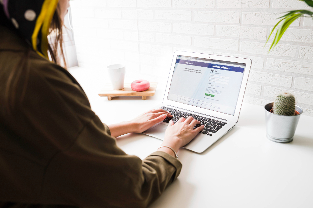 woman-login-into-facebook-website-laptop.jpg