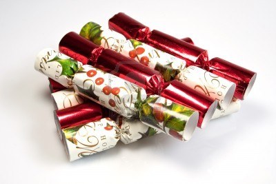 6158343-a-pile-of-christmas-crackers-against-a-white-background.jpg
