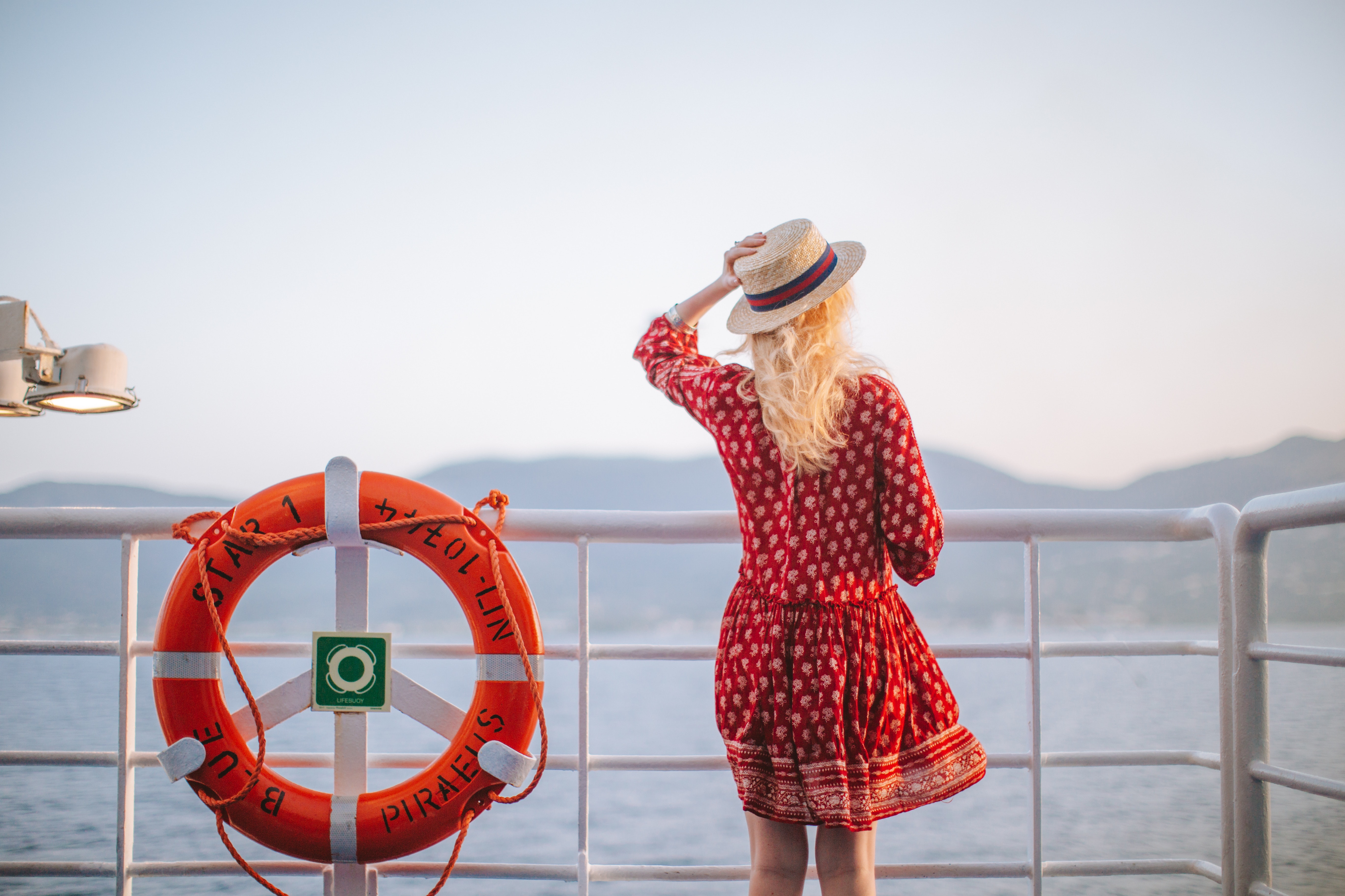 woman-in-red-dress-looking-at-the-sea-4210064.jpg