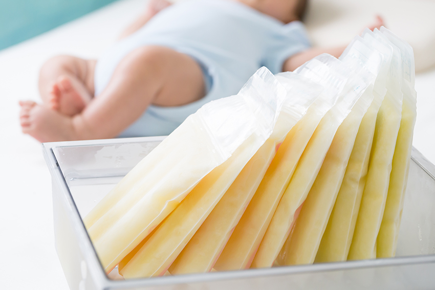 breast-milk-frozen-storage-bag-baby-lying-background.jpg