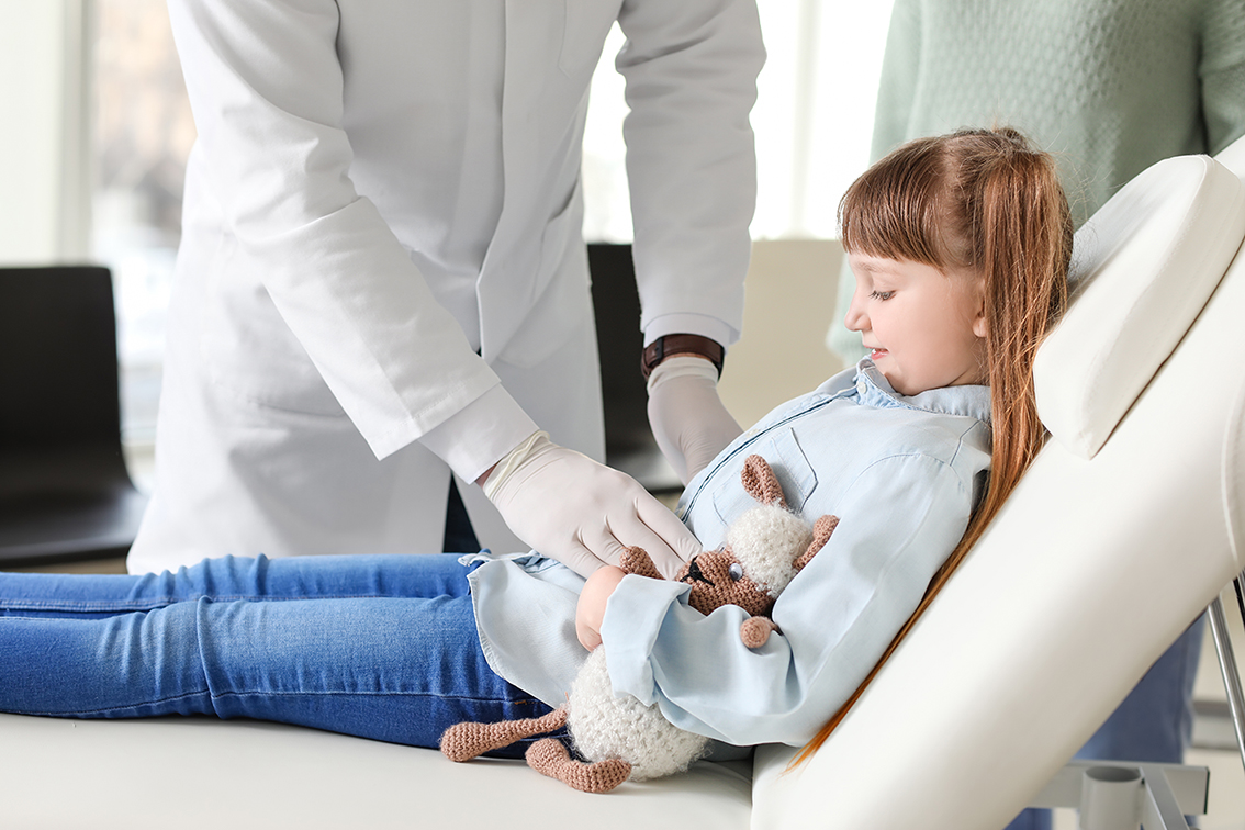 gastroenterologist-examining-little-girl-clinic.jpg
