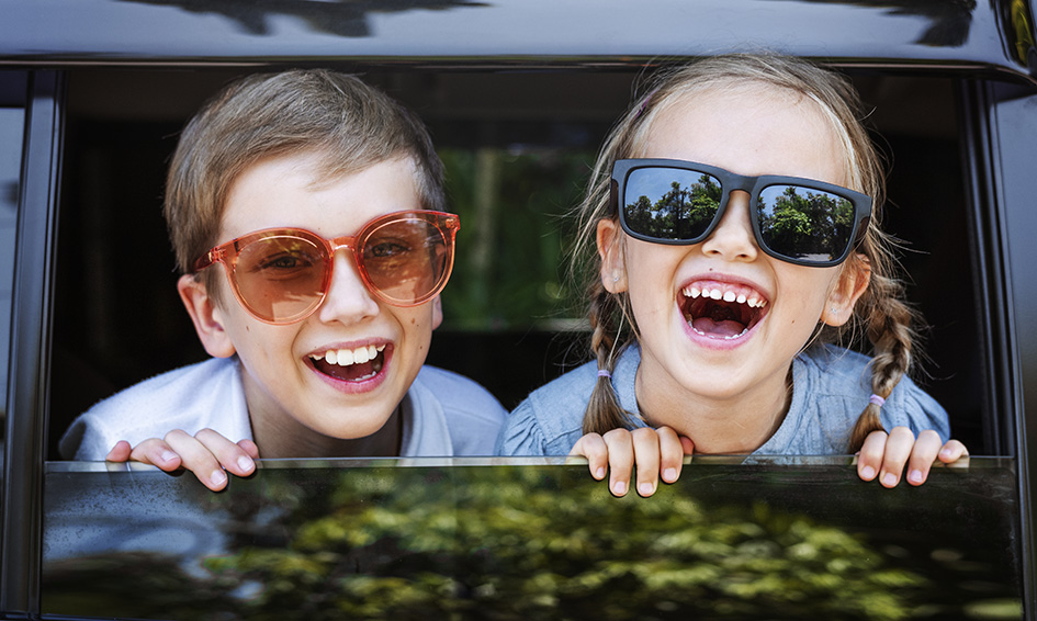 happy-kids-looking-out-car-window.jpg