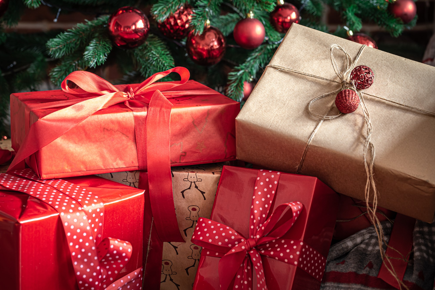 closeup-red-gift-boxes-near-christmas-tree.jpeg