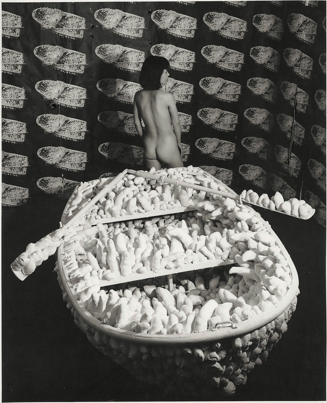 Yayoi Kusama Kusama posing in Aggregation- One Thousand Boats Show 1963 installation view, Gertrude Stein Gallery, New York 1963 © Yayoi Kusama and © Yayoi Kusama Studios Inc.jpg