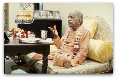Srila-Prabhupada-preaches-to-a-guest-in-his-room.jpg