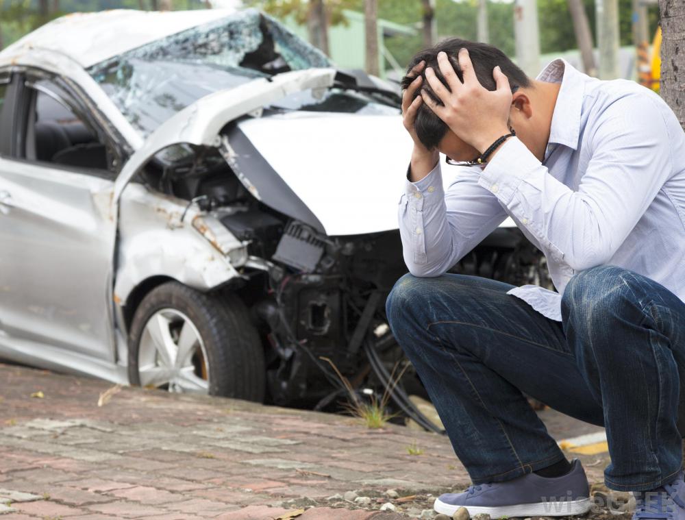man-holding-head-after-accident.jpg