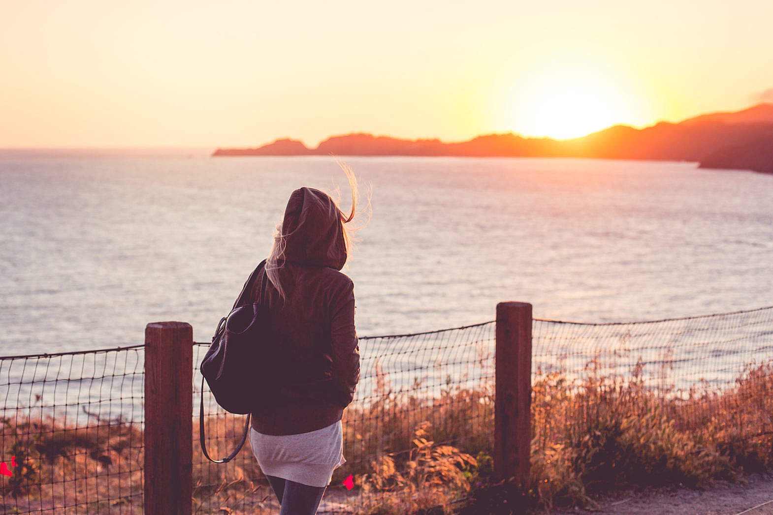 young-girl-on-a-walk-near-the-shore-at-sunset_free_stock_photos_picjumbo_hnck2769-1570x1047.jpg