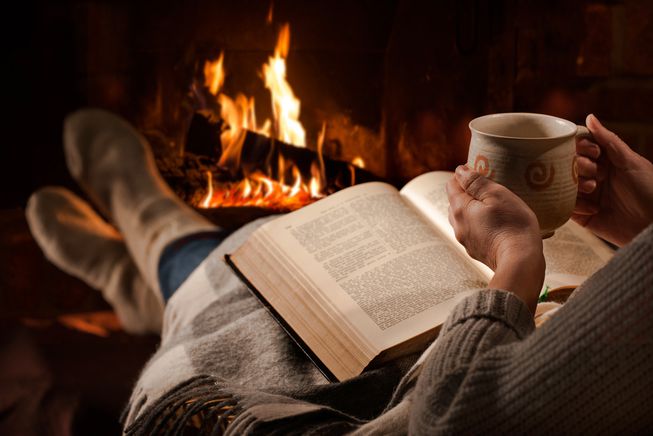 woman_sipping_chocolate_reading_book_fireplace_jpg_653x0_q80_crop-smart.jpg