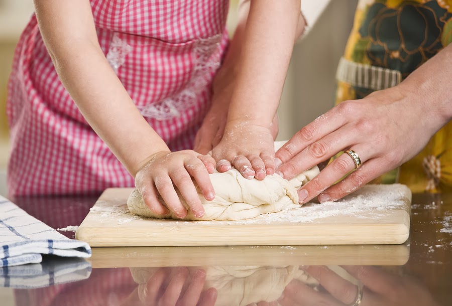 A-young-child-is-helping-make-dough.jpg