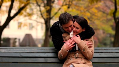 stock-footage-man-embracing-waiting-woman-from-behind-in-a-park.jpg