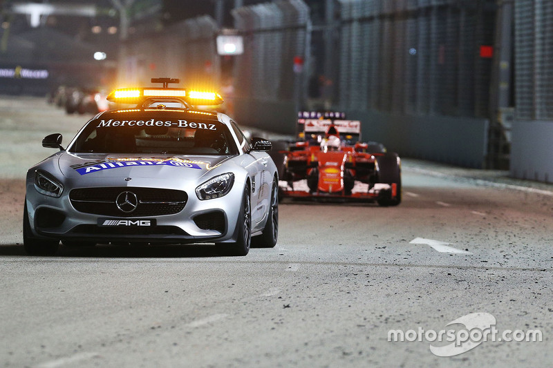 f1-singapore-gp-2015-sebastian-vettel-ferrari-sf15-t-leads-behind-the-fia-safety-car_1.jpg