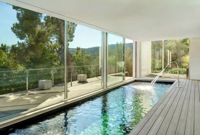19-long-and-narrow-indoor-pool-with-a-wooden-deck-and-views.jpg