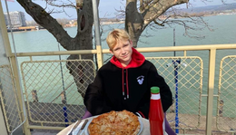 William Dunst photographed at a pizza bar in Hungary in 2021