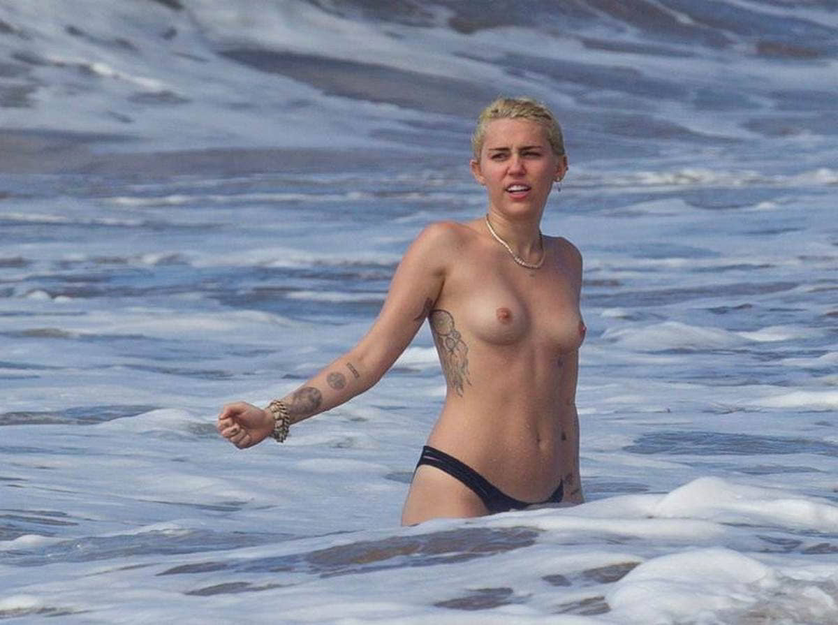 miley-cyrus-topless-on-the-beach-in-hawaii-2-3.jpg