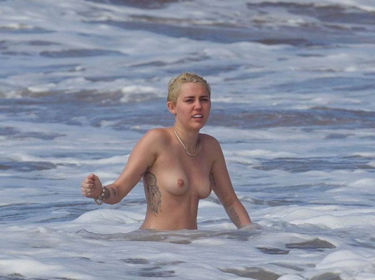 miley-cyrus-topless-on-the-beach-in-hawaii-2-4.jpg