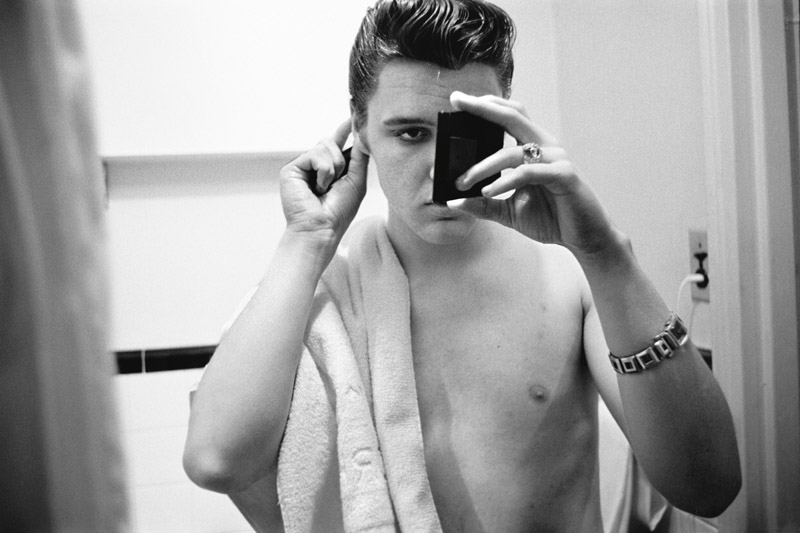03 March 17, 1956. The Warwick New York. Elvis in his hotel bathroom an hour before returning to perform on 'Stage Show.'.jpg