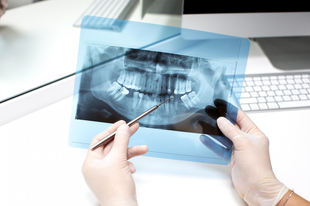 dentist-analyzes-x-ray-photo_140725-7685.jpg