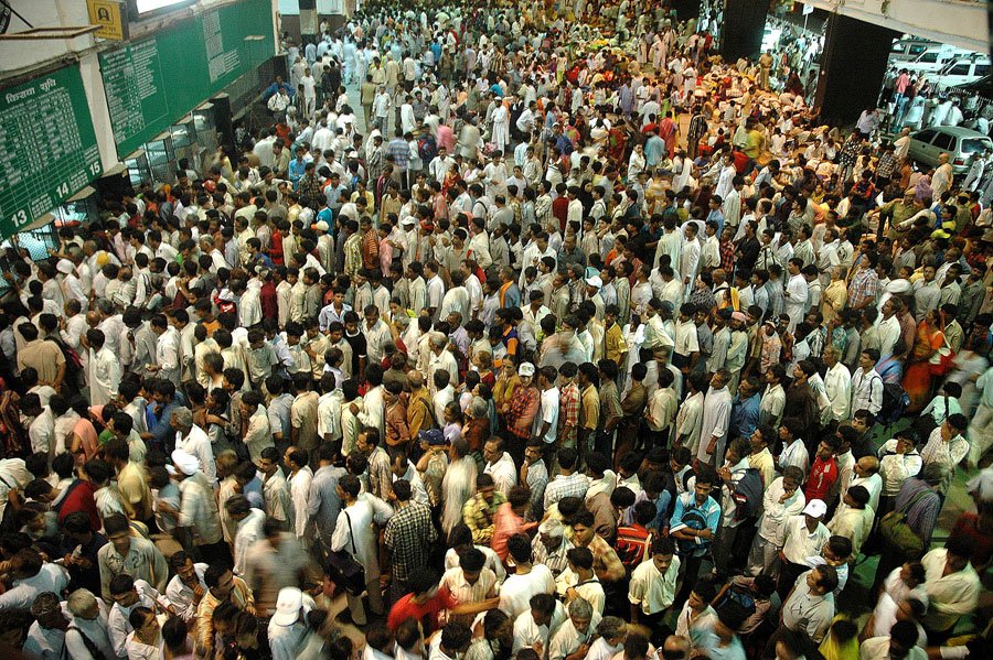 in-a-country-with-over-1-billion-people-trains-unsurprisingly-are-very-crowded-here-commuters-queue-to-buy-tickets.jpg