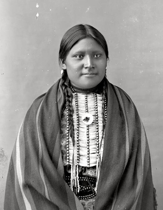 whitecowwalkingsiouxchiefsittingbullsdaughter1880s.jpg