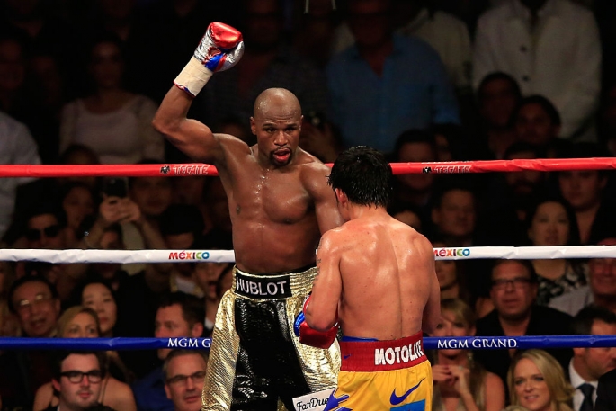 floyd-mayweather-jr-reacts-in-the-12th-round-during-the-welterweight-unification-championship-bout-on-may-2-2015-at-mgm-grand-garden-arena-in-las-vegas-nevada.jpg