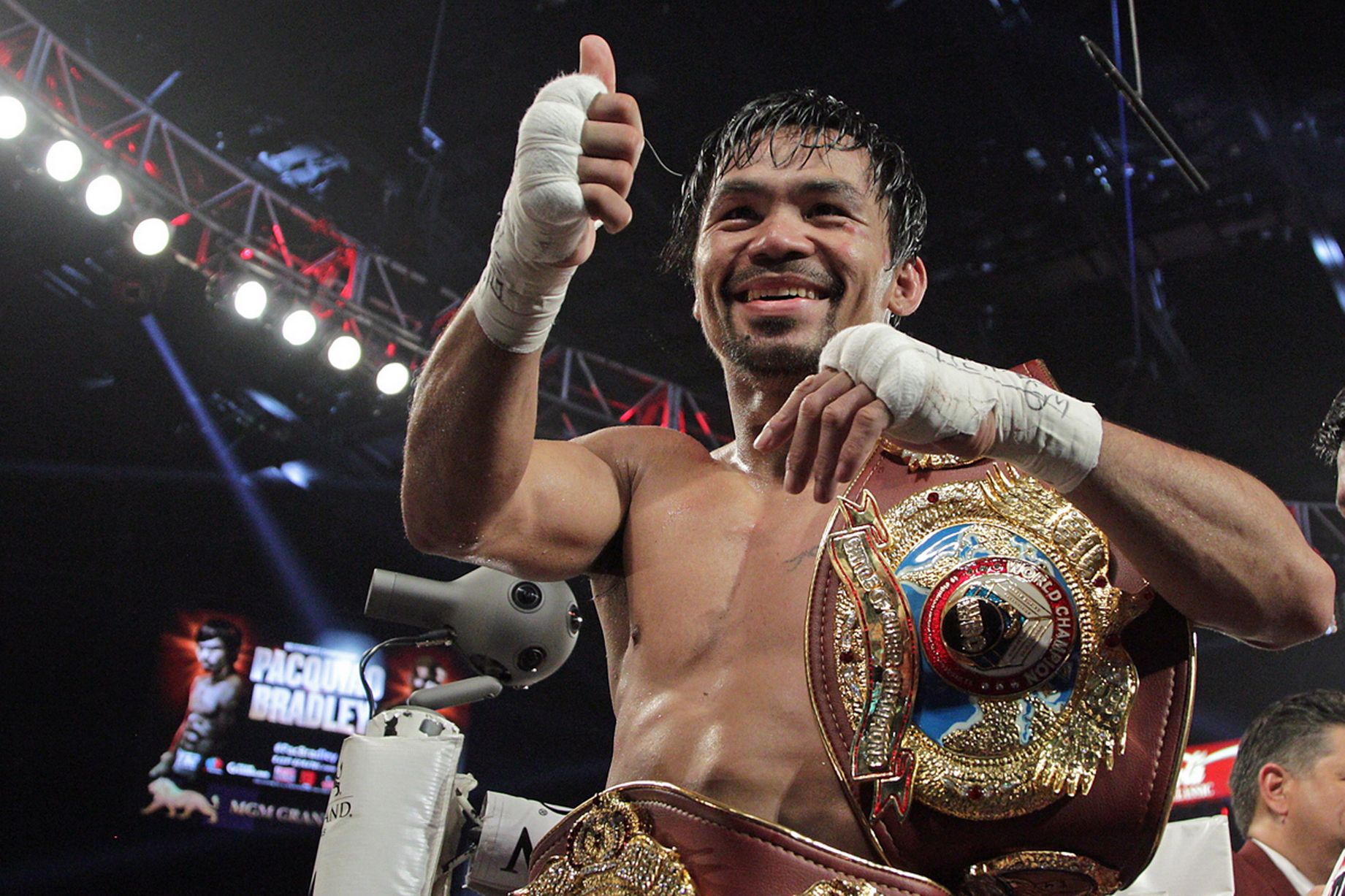manny-pacquiao-gestures-to-fans-as-he-celebrates-after-defeating-timothy-bradley-jr.jpg